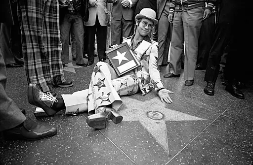 Elton John wearing hat