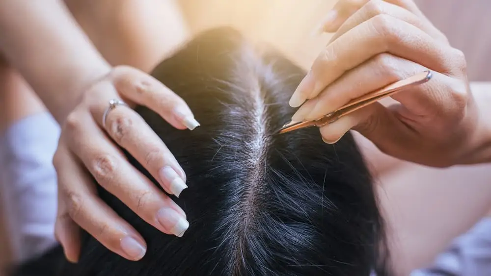 Hair plucking with tweezers