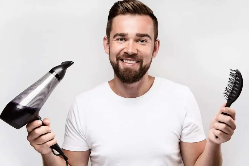 Man blowdrying hair