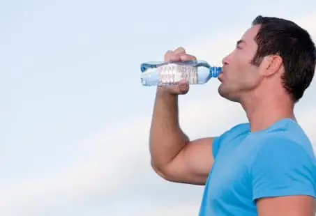 man drinking water